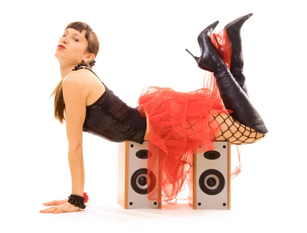 Young woman lying on speakers — Stock Photo, Image