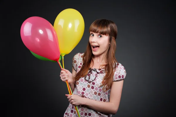 Carefree girl with balloons — Stock Photo, Image