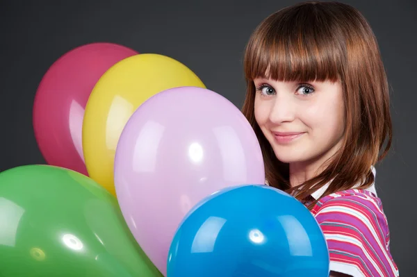 Girl with montley balloons — Stock Photo, Image