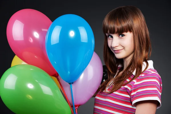 Teenager girl with motley balloons — Stock Photo, Image