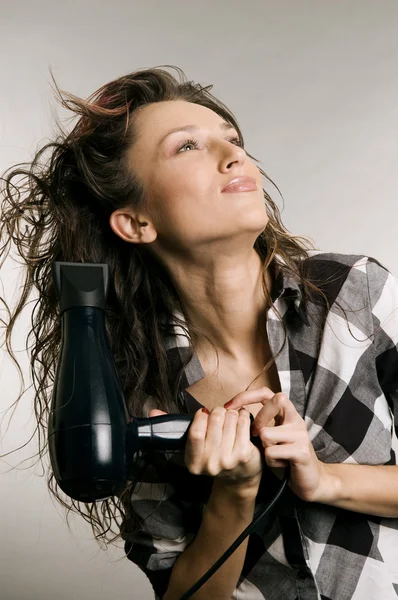 Woman blow-dry her hair — Stock Photo, Image