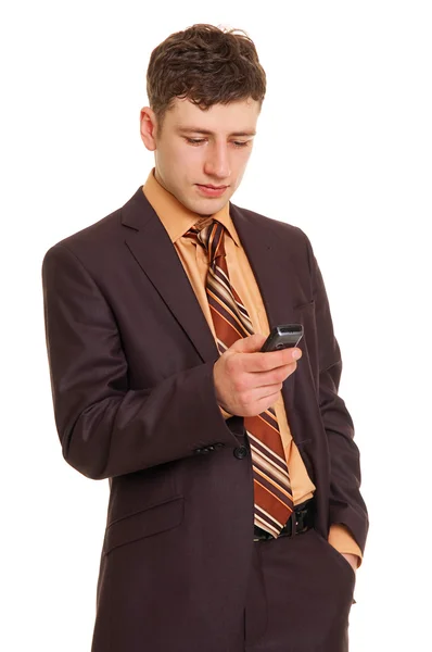 Mladý podnikatel s mobilní telefon — Stock fotografie