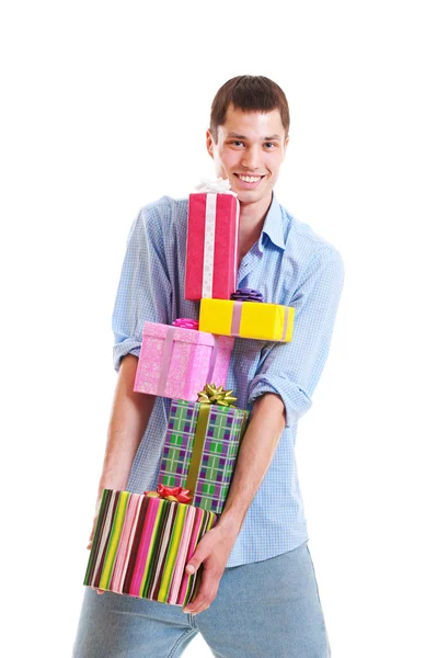Handsome man with motley gift boxes — Stock Photo, Image