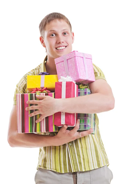 Handsome man with motley gift boxes — Stock Photo, Image