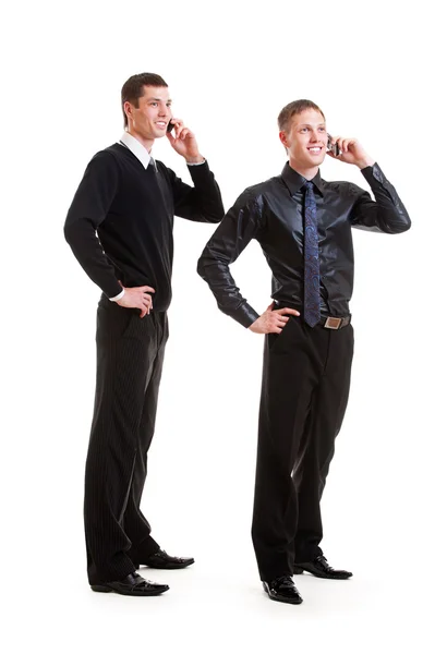 Dois homens de negócios falando ao telefone — Fotografia de Stock