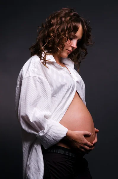 Pregnant woman looking at her belly #2 — Stock Photo, Image