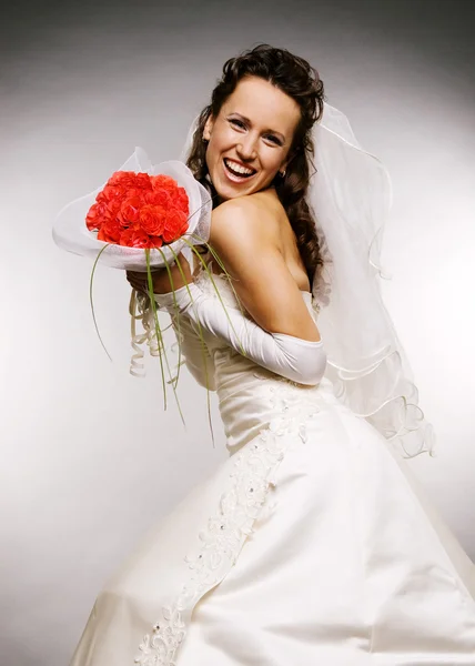 Bride with bouquet of roses Stock Image