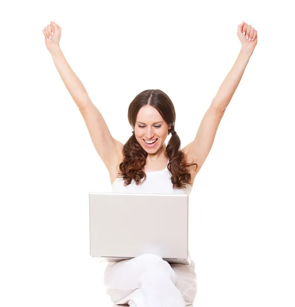 快乐的年轻女人用的笔记本电脑 图库图片