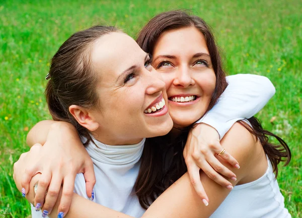 Two happy friends is embracing Royalty Free Stock Images