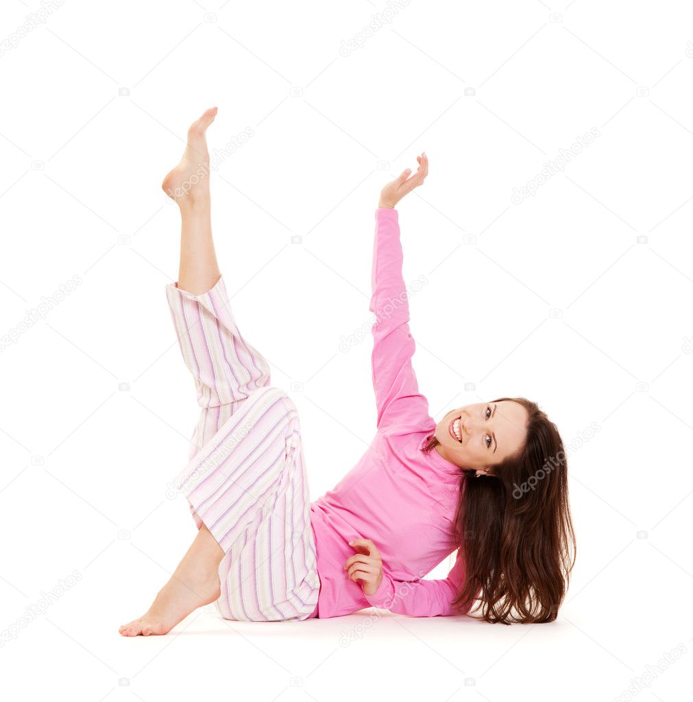 Beautiful young woman in pink pyjamas