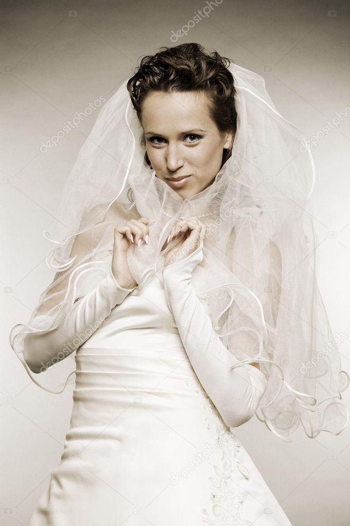 Smiley bride in wedding dress