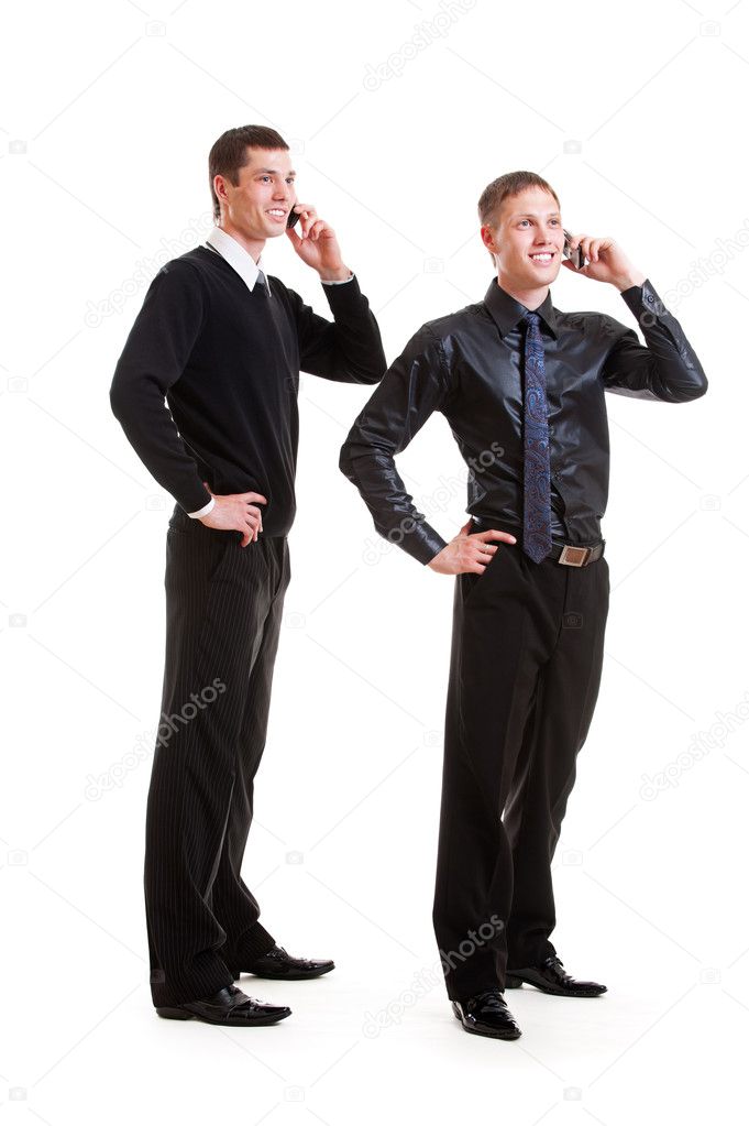 Two businessmen talking on the phone