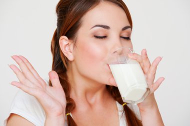 Young woman drinking milk clipart