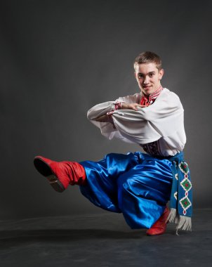 Young cossack dancing clipart