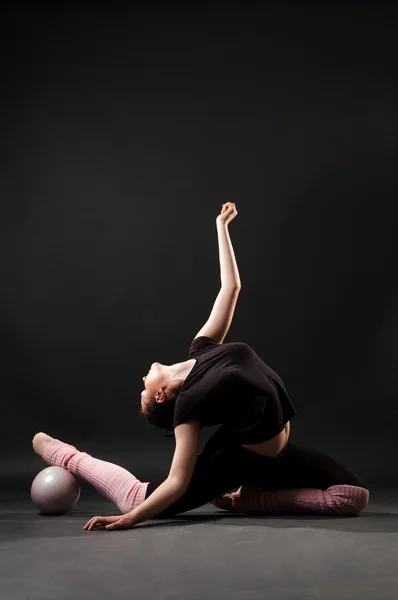 Contortionist with ball — Stock Photo, Image