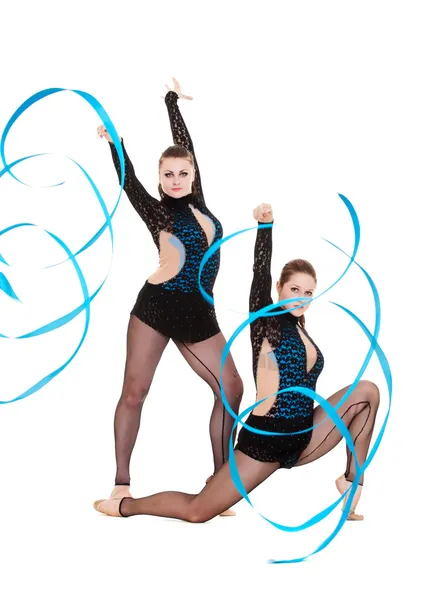Flexible gymnasts dancing with blue ribbons — Stock Photo, Image