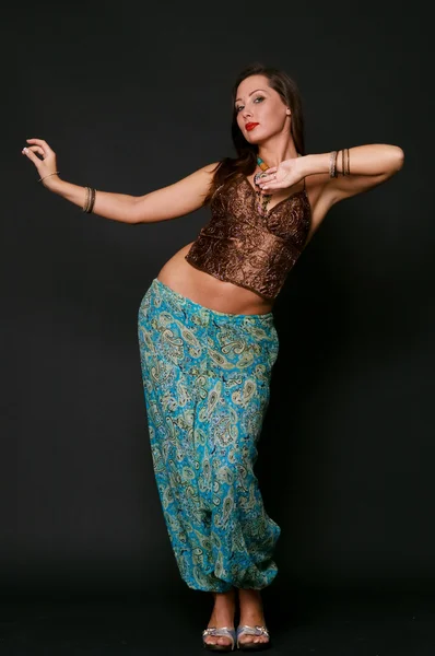 Young girl dancing in indian clothes — Stock Photo, Image