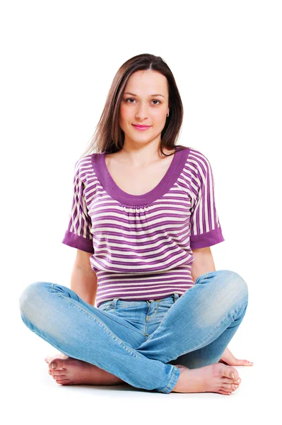 Pretty young woman sitting on the floor — Stock Photo, Image