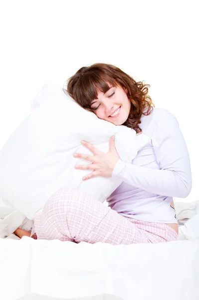 Mulher sorridente bonita com travesseiro — Fotografia de Stock