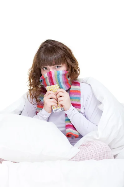 Girl in scarf with pills — Stock Photo, Image