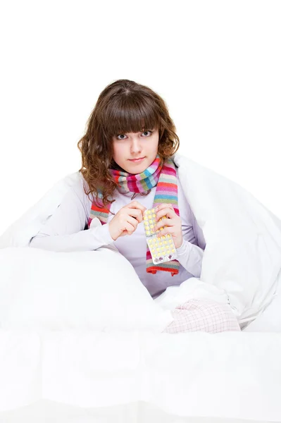 Enfermo chica sosteniendo pastillas —  Fotos de Stock
