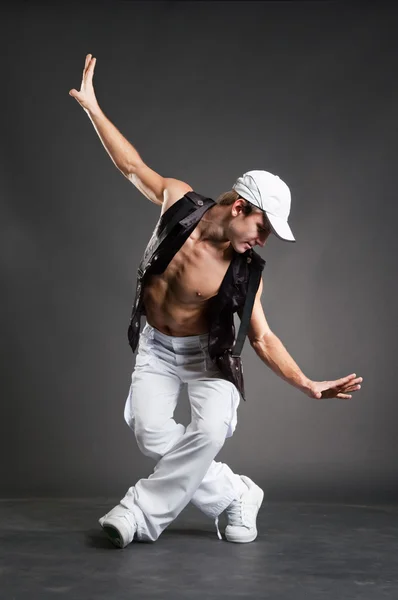 Stylish dancer in white cap posing — Stock Photo, Image