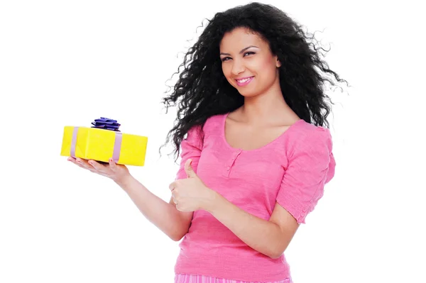 Pretty woman holding small yellow gift — Stock Photo, Image