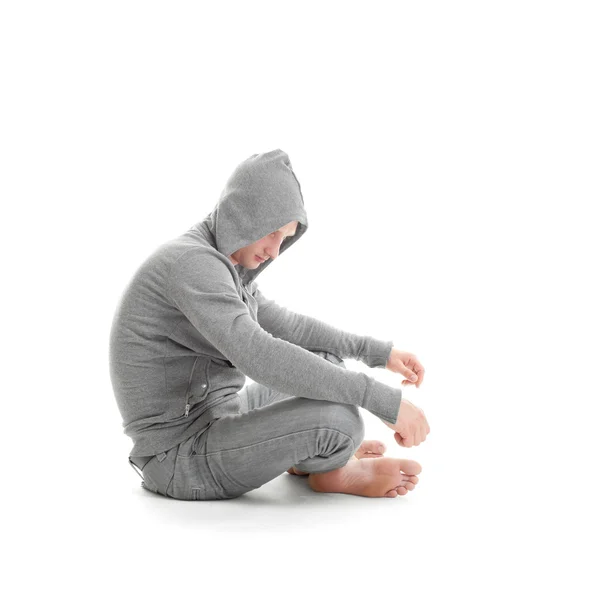 Sad guy sitting and looking down — Stock Photo, Image