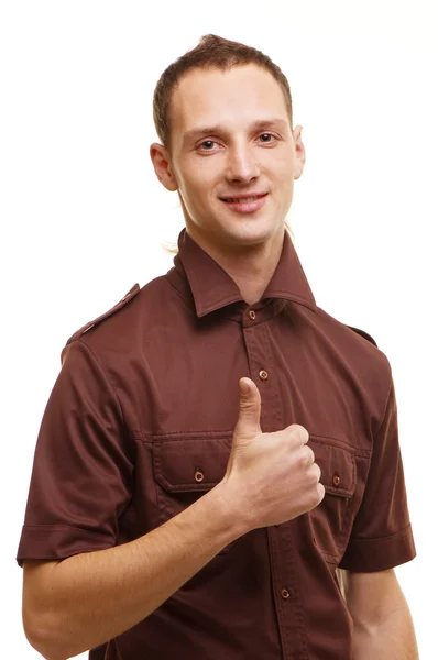 Úspěšný mladý muž ukazuje palec — Stock fotografie