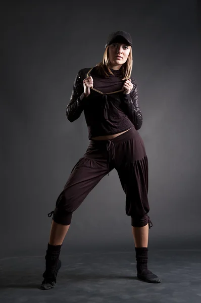 Attractive blond in black clothes dancing — Stock Photo, Image