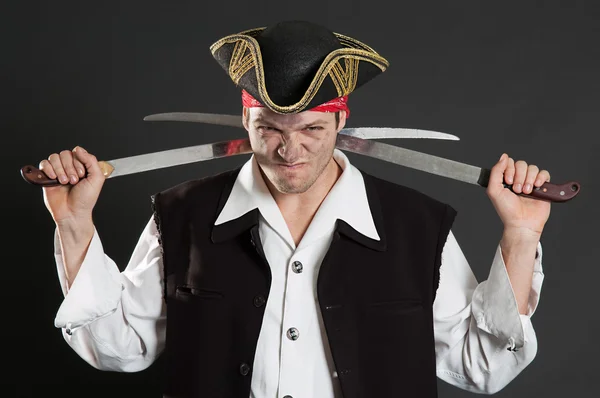 Dirty pirate with two sabres — Stock Photo, Image