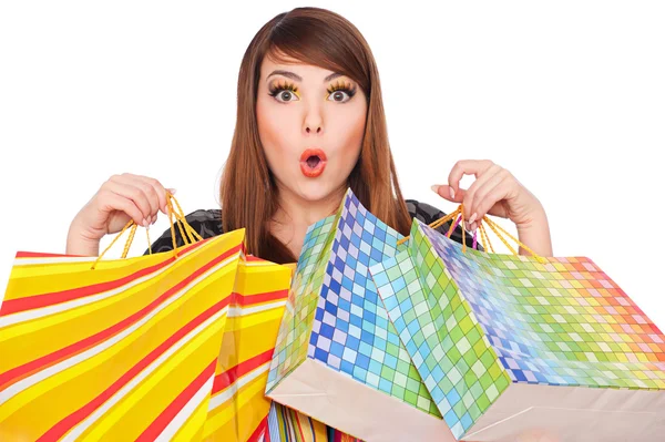 Menina engraçada com sacos de compras — Fotografia de Stock