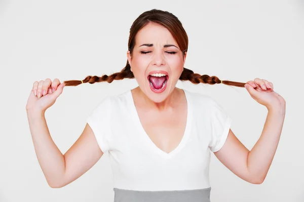 Funny screaming girl with two pigtails — Stock Photo, Image