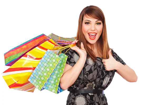 Gelukkige jonge vrouw met boodschappentassen — Stockfoto