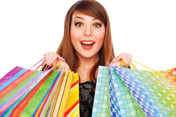 Ευτυχισμένη νεαρή γυναίκα με τσάντες για ψώνια. — Φωτογραφία Αρχείου