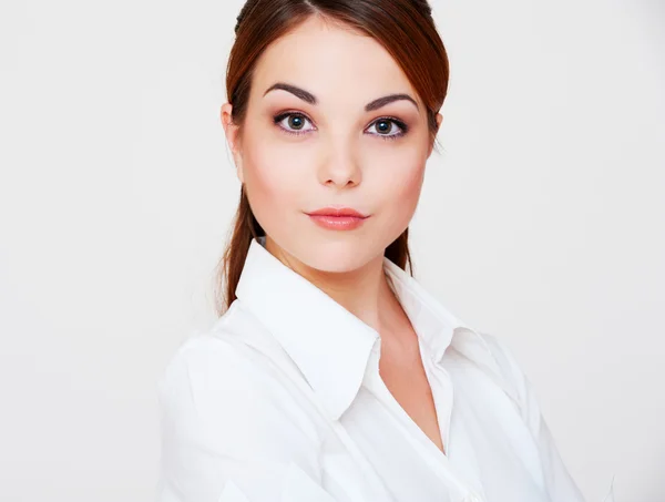 Lovely serious woman in white shirt — Stock Photo, Image