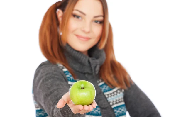 Pretty smiley woman holding green apple — Stock Photo, Image