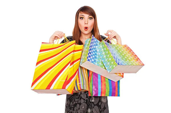 Mulher surpresa com sacos de compras — Fotografia de Stock
