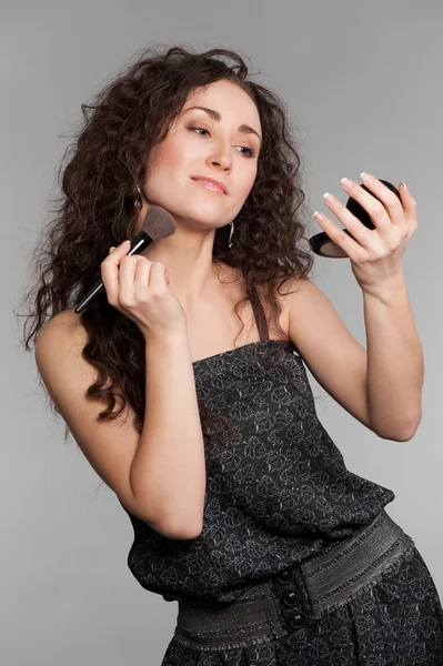 Attractive woman with morror and brush — Stock Photo, Image