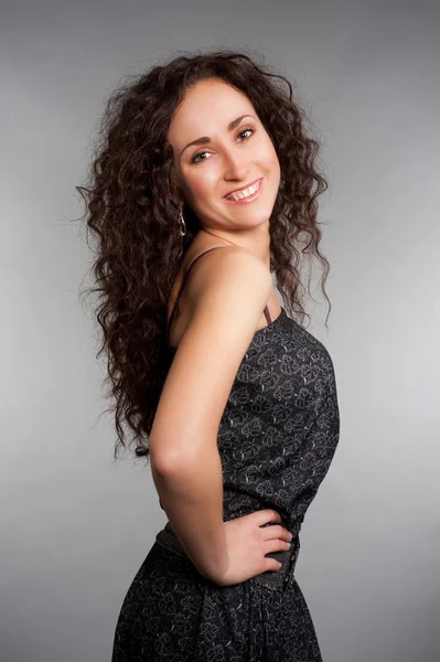 Lively woman with long curly hair — Stock Photo, Image