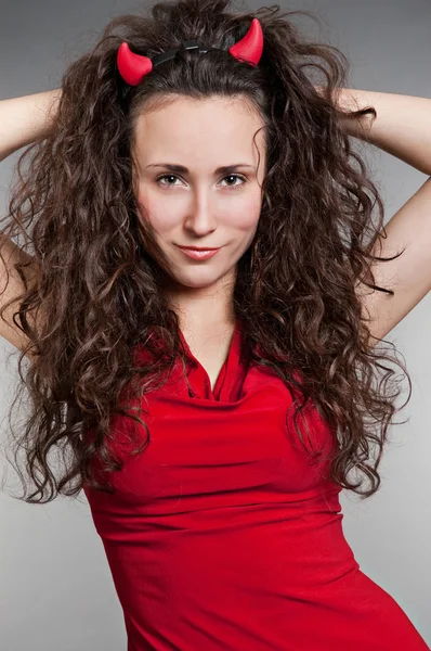 Sexy devil with long curly hair — Stock Photo, Image