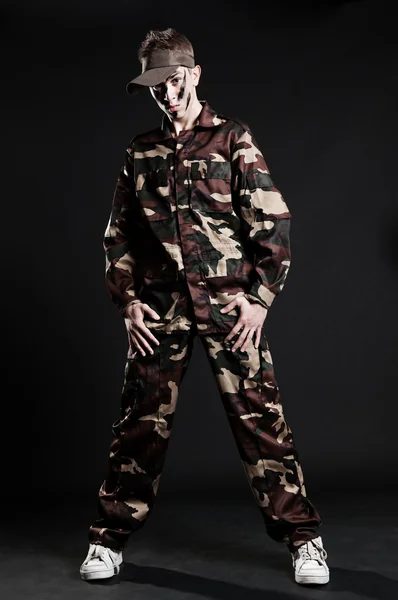 Serious dancer in camouflage — Stock Photo, Image