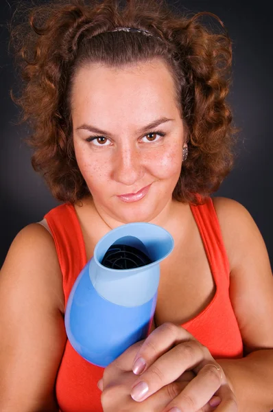 Housewife with hairdryer — Stock Photo, Image