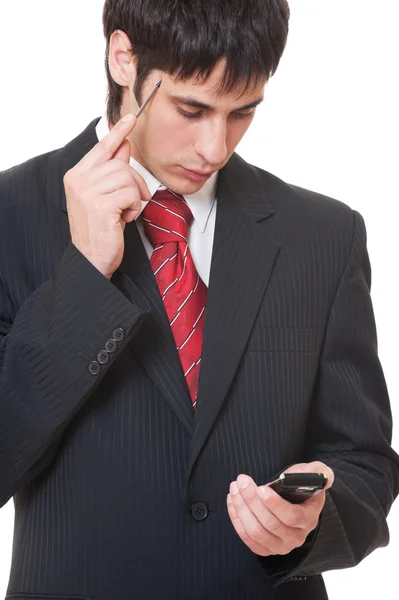 Uomo d'affari serio con smartphone — Foto Stock