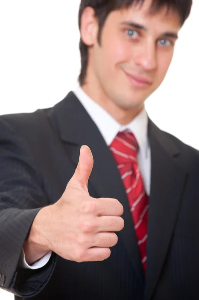 Uomo d'affari sorridente mostrando pollici in su — Foto Stock
