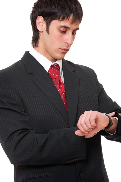 Young businessman looking at watch — Stock Photo, Image