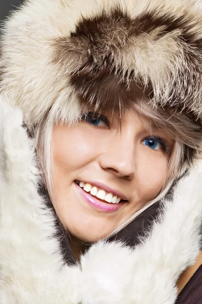Blond with blue eyes in furs — Stock Photo, Image