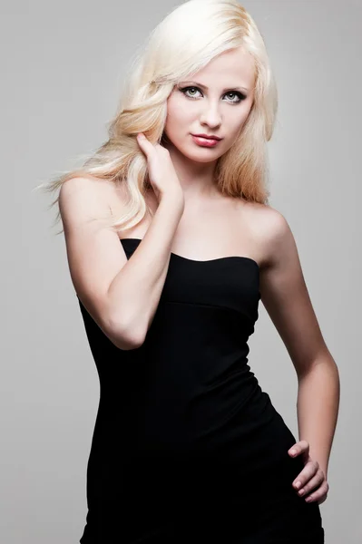 Young woman in black dress — Stock Photo, Image