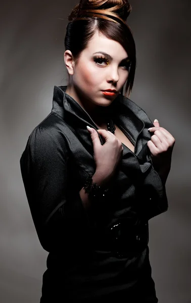 Beautiful woman in dark dress Stock Photo