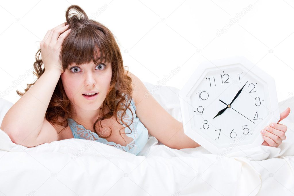 Frightened woman with clock